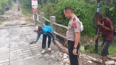 Polsek Hamparan Perak Kawal Pembangunan Jembatan Merah Putih Presisi di Klambir V Kebun